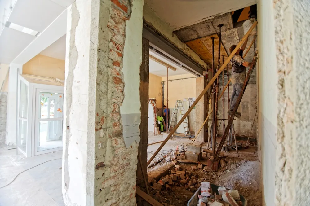 Homeowner documenting damage with smartphone